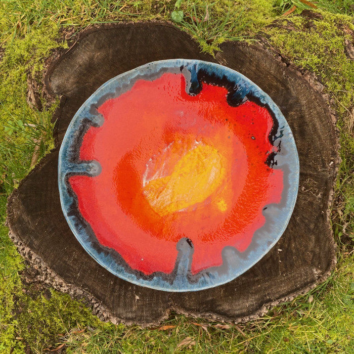 decorative ceramic platter plate with a multi coloured volcanic glaze