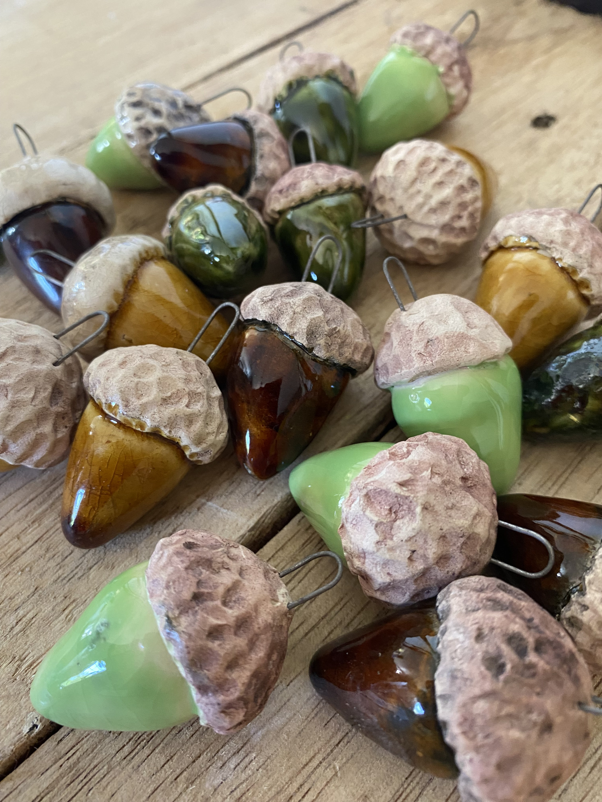 a collection of ceramic acorn hanging decorations